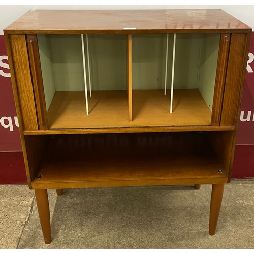 39 - A teak tambour front record cabinet