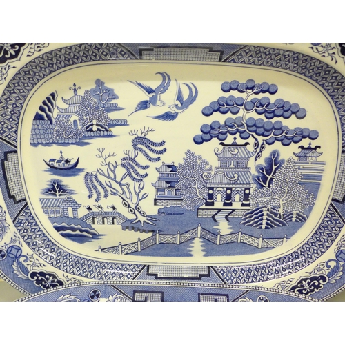 2004 - A pair of Staffordshire Willow pattern porcelain meat plates, 47cm