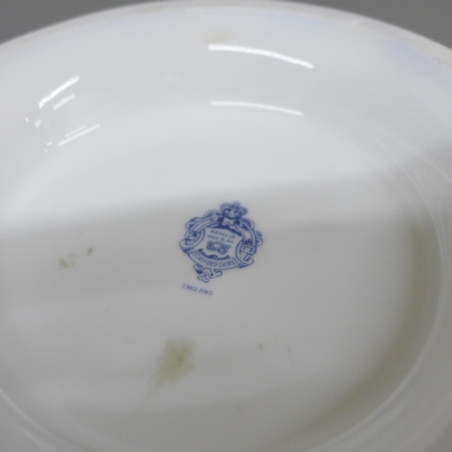 2006 - A Staffordshire Roselle Occ & Co. porcelain vase, blue and gilt with flower detail, 29cm