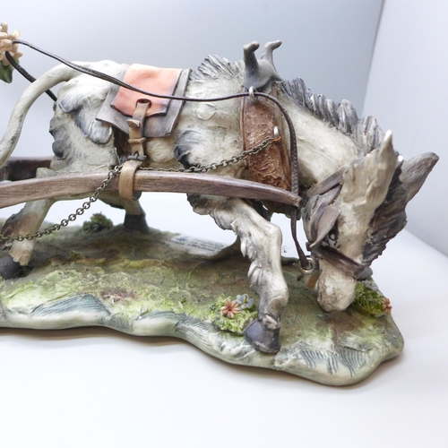 2021 - An Italian Capodimonte porcelain figure, 'The Reluctant Donkey', modelled by G. Cortese