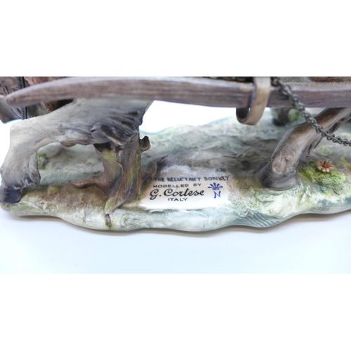 2021 - An Italian Capodimonte porcelain figure, 'The Reluctant Donkey', modelled by G. Cortese