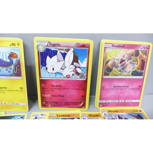 2030 - A collection of Pokemon cards with vintage and rares, approximately 560, in collectors tin