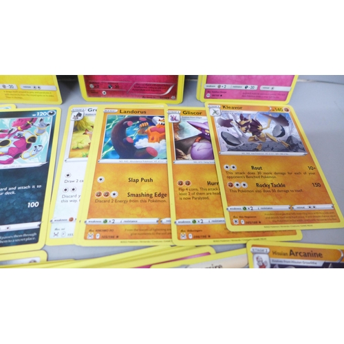 2030 - A collection of Pokemon cards with vintage and rares, approximately 560, in collectors tin