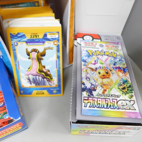 2038 - A collection of Pokémon/Pokédex stickers and cards