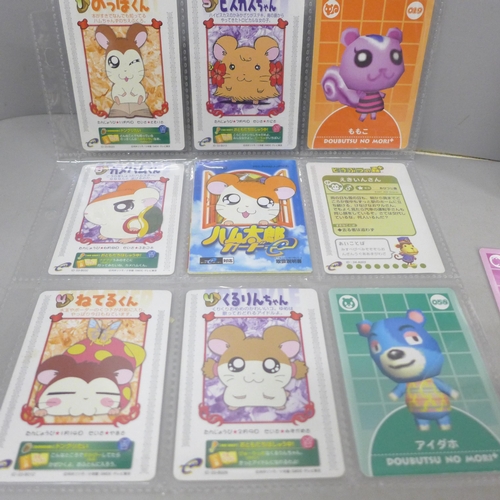 2052 - A Game Boy Advance card reader with readable Pokémon cards