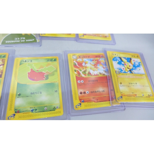 2052 - A Game Boy Advance card reader with readable Pokémon cards