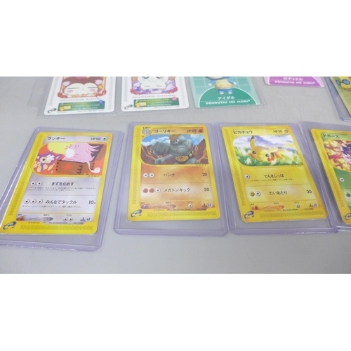 2052 - A Game Boy Advance card reader with readable Pokémon cards