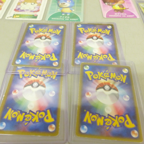 2052 - A Game Boy Advance card reader with readable Pokémon cards