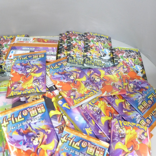 2059 - A collection of Japanese Pokémon cards, open packs with cards