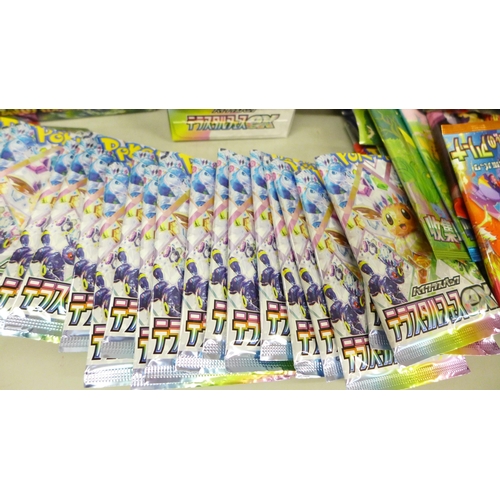 2059 - A collection of Japanese Pokémon cards, open packs with cards