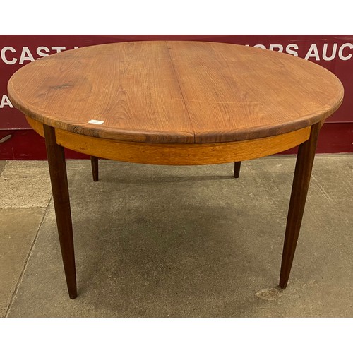 36 - A G-Plan Fresco teak circular extending dining table
