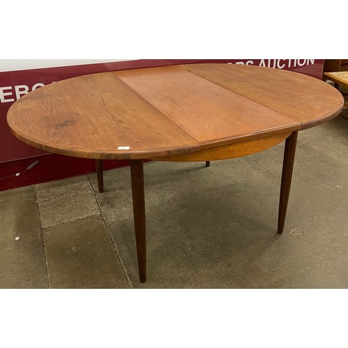 36 - A G-Plan Fresco teak circular extending dining table