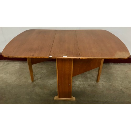 57 - A teak drop-leaf table