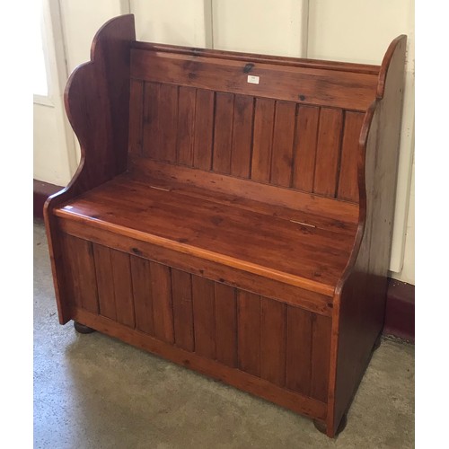 239 - A stained pine pew