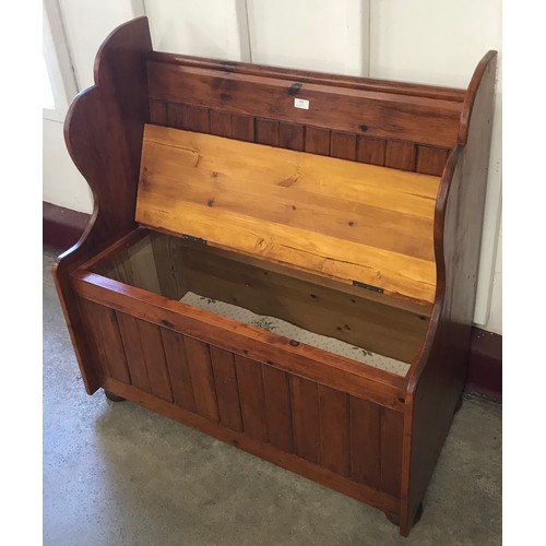 239 - A stained pine pew