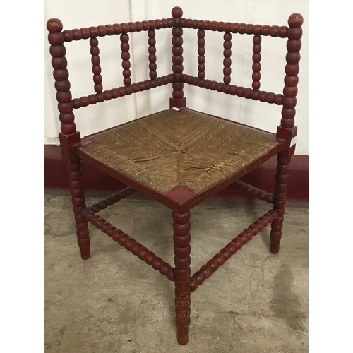 245 - A Victorian painted bobbin turned and rush seated corner chair