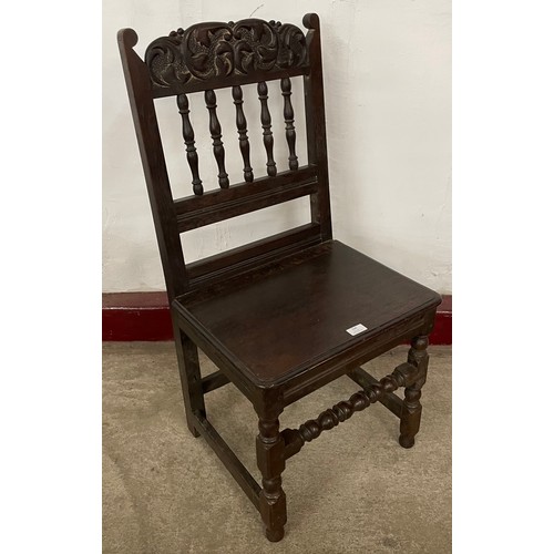 262 - A 17th Century style carved oak chairback stool