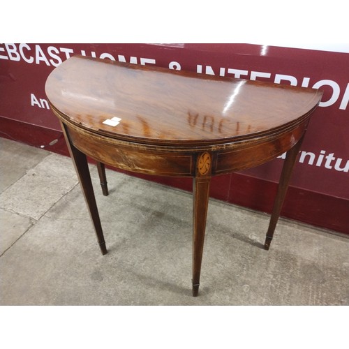 232 - A George III inlaid mahogany demi lune fold-over tea table