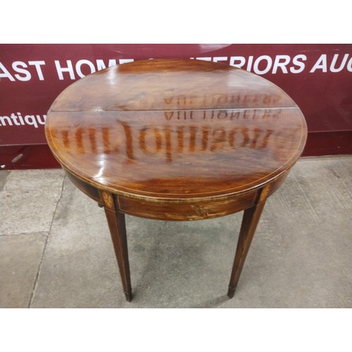 232 - A George III inlaid mahogany demi lune fold-over tea table