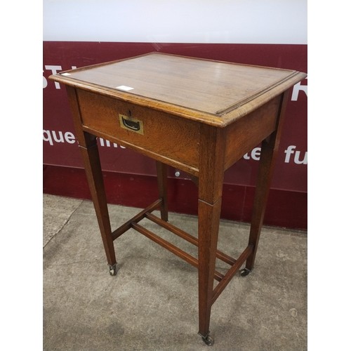 237 - An Edward VII oak campaign style single drawer side table