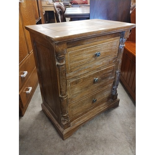 241 - A French style limed oak chest of drawers