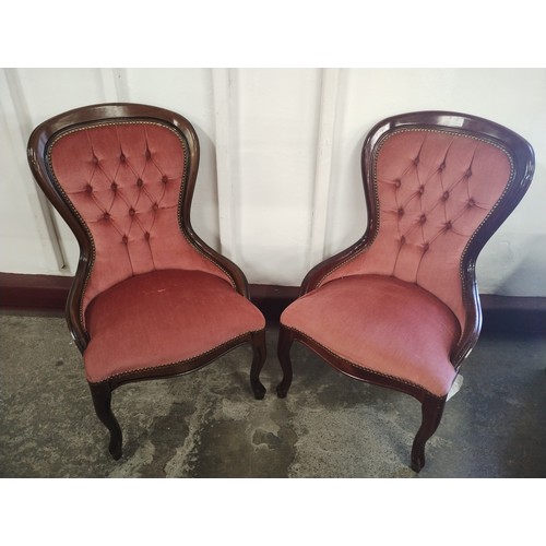 242 - A pair of Victorian style mahogany and salmon pink fabric upholstered spoonback lady's chairs