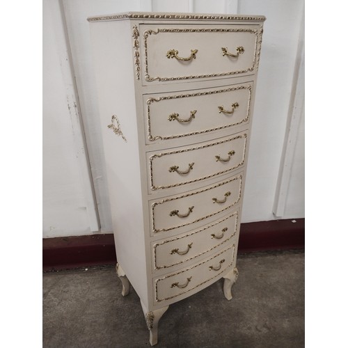 249 - A French style cream and parcel gilt chest of drawers