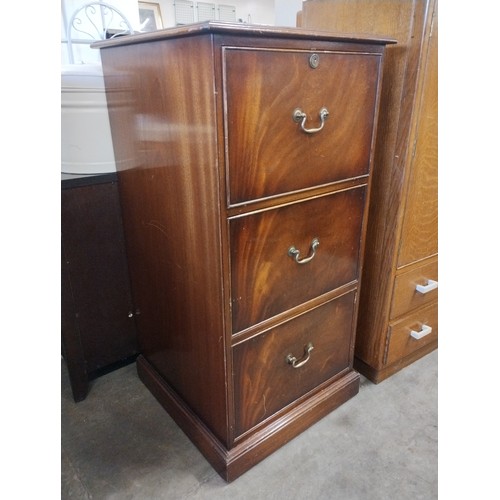 250 - A mahogany three drawer filing cabinet