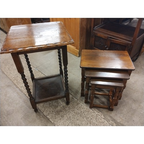 256 - An early 20th Century oak barleytwist occasional table and an oak nest of tables