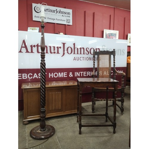 259 - An early 20th Century oak occasional table, a Priory oak blanket box, a beech barleytwist standard l... 