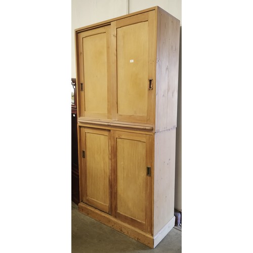 265 - A Victorian style pine and beech sliding four door office cupboard