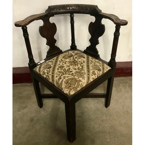 271C - A Victorian Jacobean Revival carved oak corner chair
