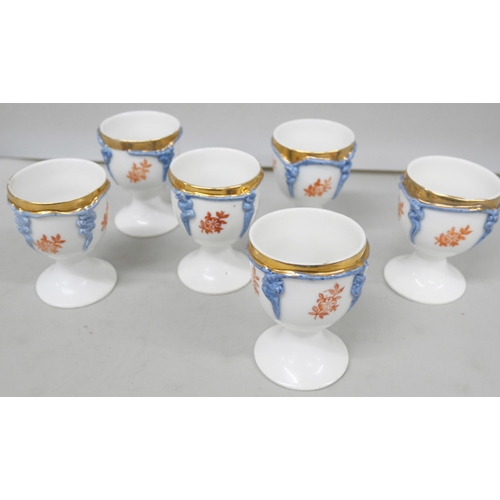 2034 - A set of six Continental porcelain egg cups, 6.5cms h
