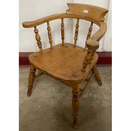 131 - A Victorian elm and beech smokers bow chair