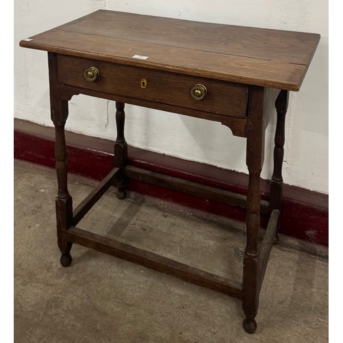 147 - A Victorian oak single drawer side table
