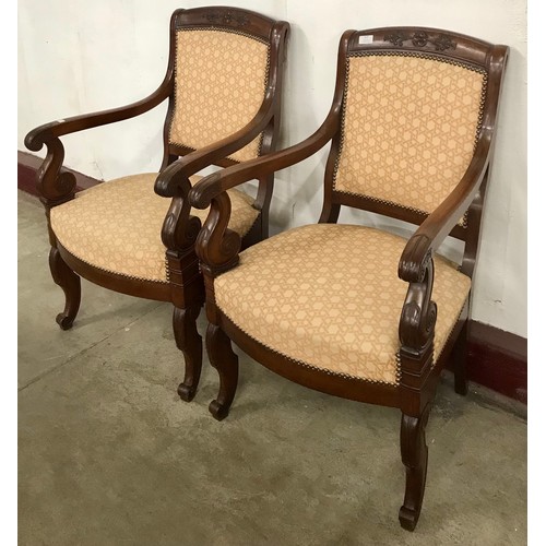 127 - A pair of 19th Century French carved walnut and fabric upholstered fauteuil chairs