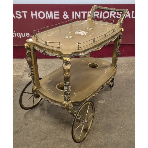 134 - An Italian Venetian style giltwood two tier cocktail trolley