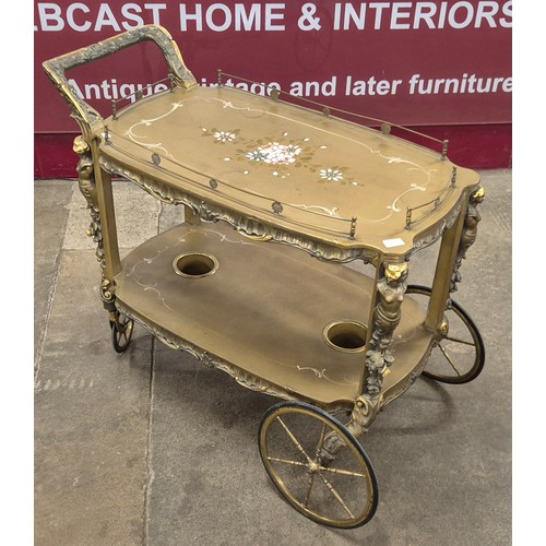 134 - An Italian Venetian style giltwood two tier cocktail trolley