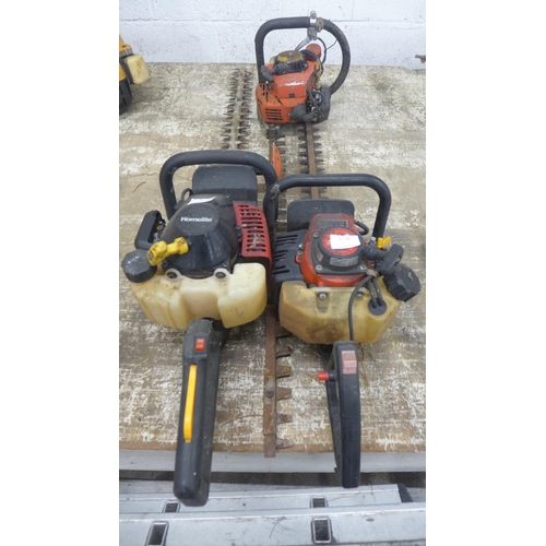 5174 - A Homelite HHT2660 petrol hedge trimmer, a Kawasaki TG18 petrol hedge trimmer and 1 other trimmer