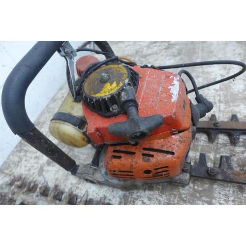 5174 - A Homelite HHT2660 petrol hedge trimmer, a Kawasaki TG18 petrol hedge trimmer and 1 other trimmer