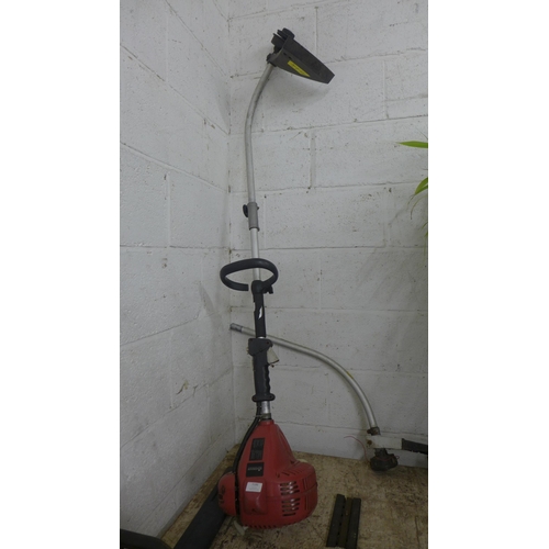 5186 - A Sovereign petrol strimmer with additional strimmer attachment