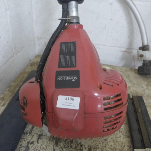 5186 - A Sovereign petrol strimmer with additional strimmer attachment