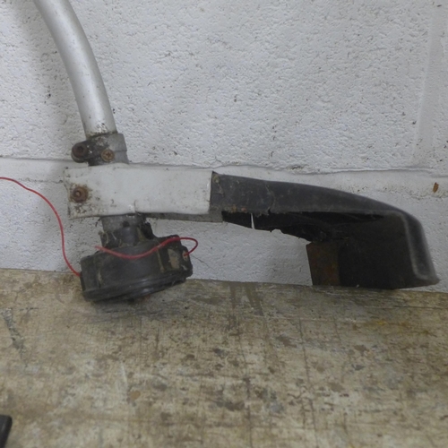 5186 - A Sovereign petrol strimmer with additional strimmer attachment