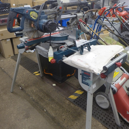 5211 - A Bosch Professional GCM85JL, 110V chop saw with a Bosch GTA2600 with saw stand and various accessor... 