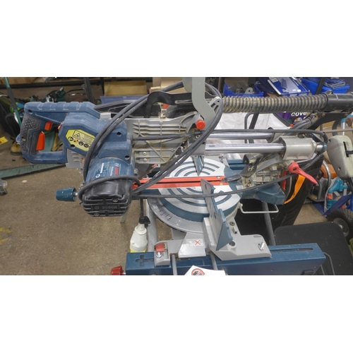 5211 - A Bosch Professional GCM85JL, 110V chop saw with a Bosch GTA2600 with saw stand and various accessor... 