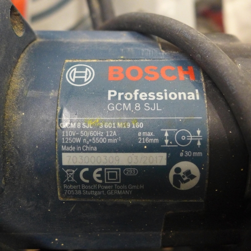 5211 - A Bosch Professional GCM85JL, 110V chop saw with a Bosch GTA2600 with saw stand and various accessor... 
