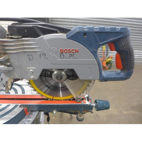 5211 - A Bosch Professional GCM85JL, 110V chop saw with a Bosch GTA2600 with saw stand and various accessor... 