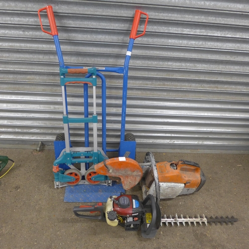5214 - A petrol stone cutting saw, a Kawasaki KHT600S petrol hedge trimmer and 2 sack trucks