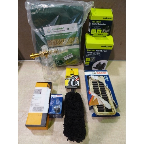 6144 - A box of car related items to include supreme wheel brush, Sakura seat covers, digital tyre pressure... 