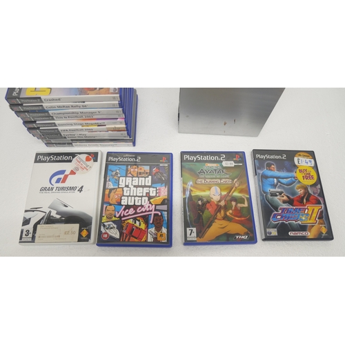 8033 - A limited edition silver PlayStation 2 with 14 boxed PlayStation 2 games